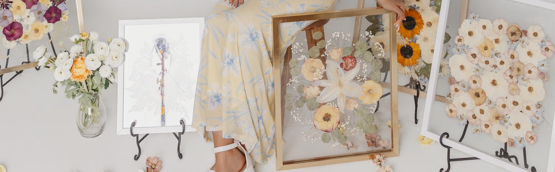 Several finished pressed-flower frames arranged together